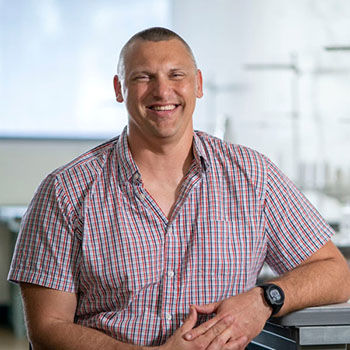man sitting next to work station