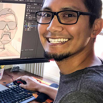 young man at a computer doing design work