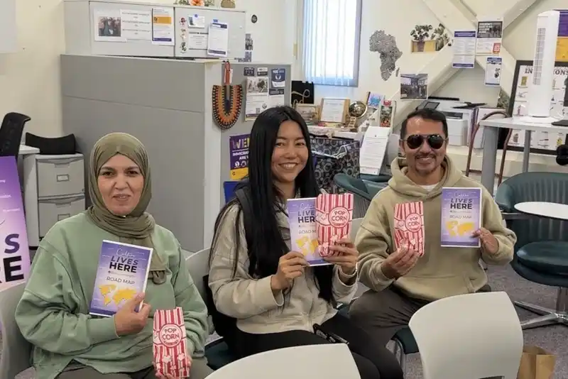 a group of people attending the Indigenous Peoples' Day screening