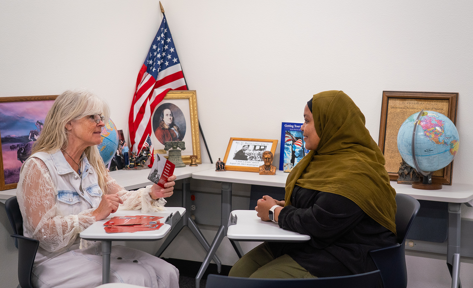 Two females sitting in a room