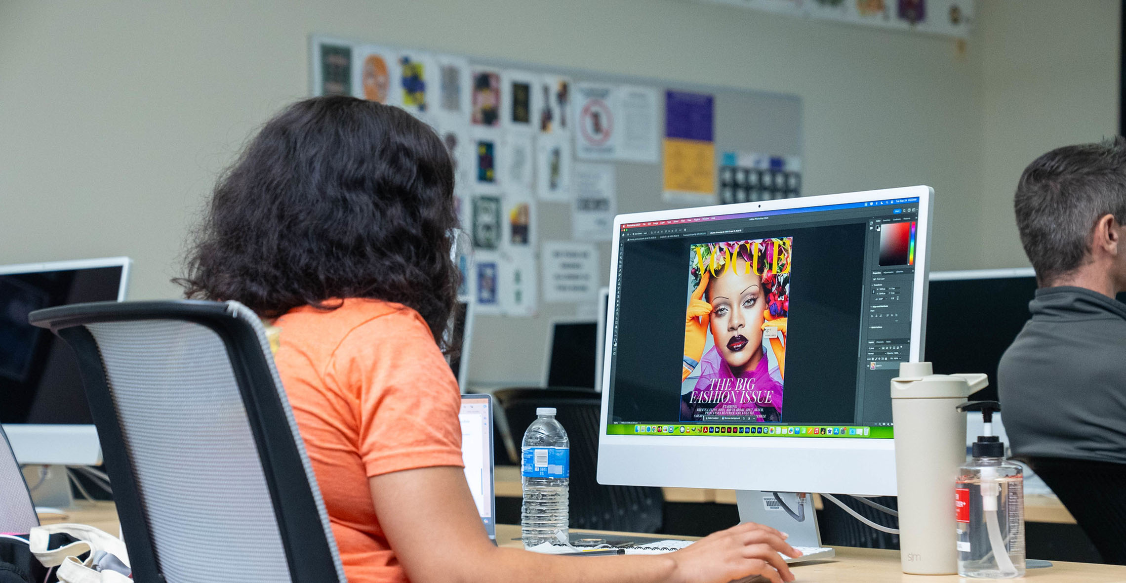 Digital Media student working on design on computer 