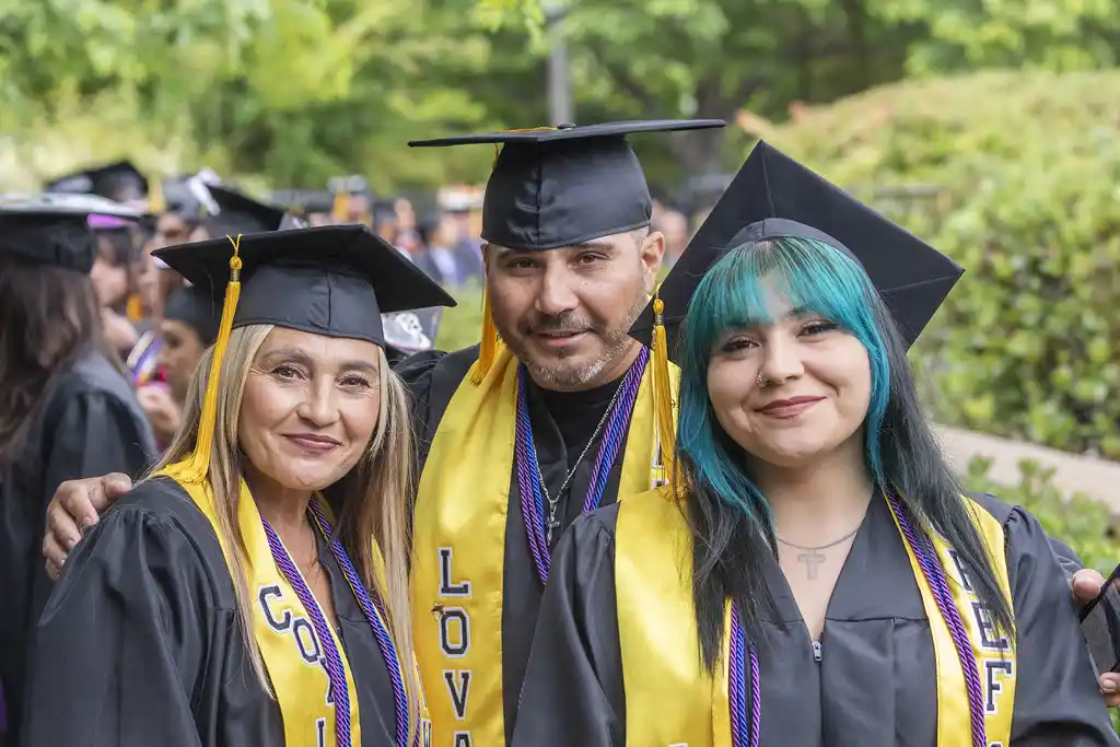 A family of graduates celebrate during the 2025 SDCCE and SDUSD Joint Commencement Ceremony