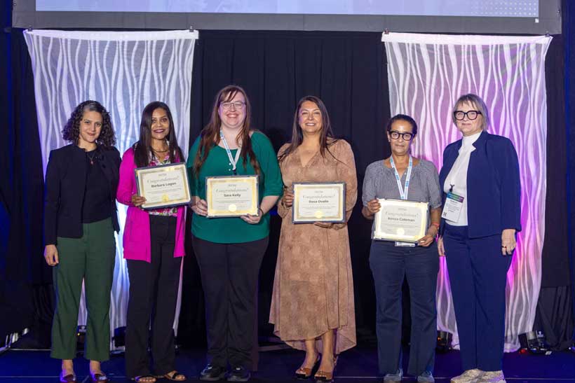 Clothing and Textiles students Barbara Logan, Sara Kelly, Rosa Ovalle, Kenza Coleman, and Program Chair Shirely Peirson on stage at the Textile Recovery Summit