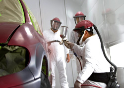 students painting car