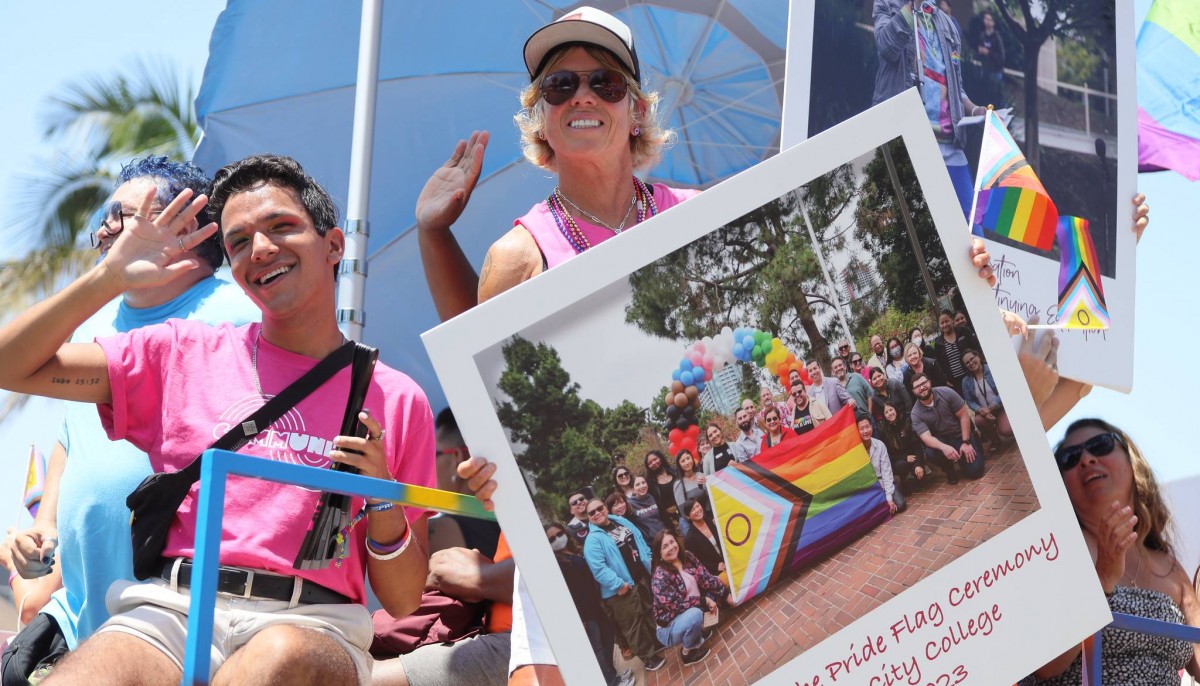 Jeremy Garcia and Dr. Lisa Carulli join the San Diego Community College District in the San Diego Pride Parade