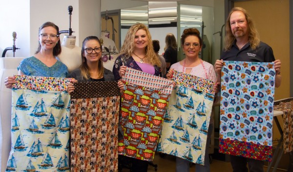 Fashion students sew pillowcases for San Diego’s foster youth. The fabric was donated by Visions Art Museum and the Delta Phi Sorority.