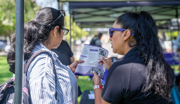 Members of the community meet with the San Diego College of Continuing Education team to learn more about courses offerings and resources.