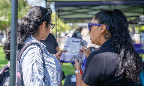 Members of the community meet with the San Diego College of Continuing Education team to learn more about courses offerings and resources.