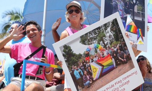 Jeremy Garcia and Dr. Lisa Carulli join the San Diego Community College District in the San Diego Pride Parade