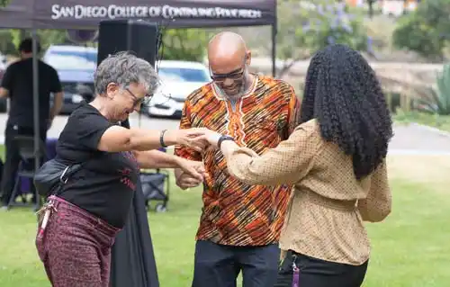 3 people dancing